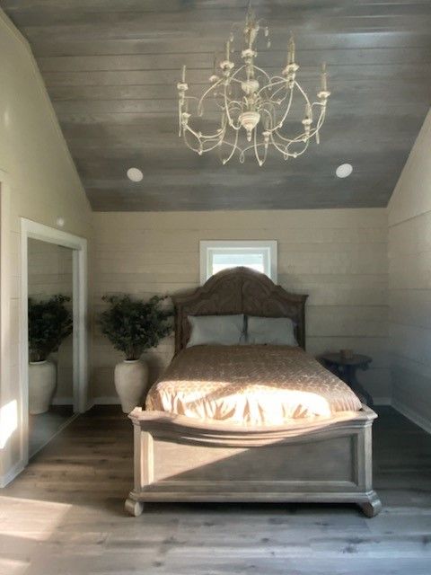 Master bedroom with updated lighting and finishes