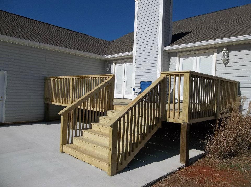 Custom wooden deck addition on residential property