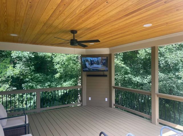 Custom screened porch with ceiling fan built by Perry Rogers
